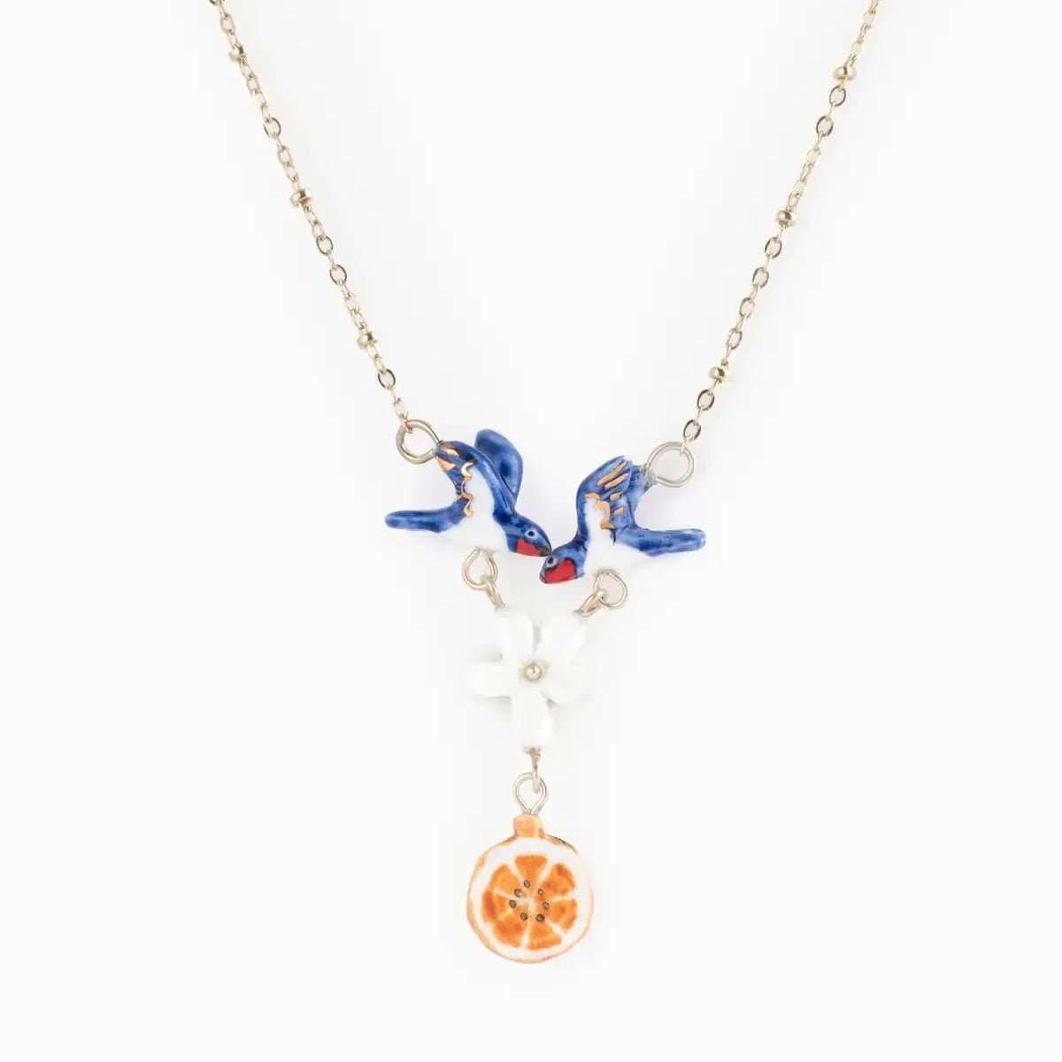 Collar Golondrinas y Naranja Nach Bijoux, porcelana pintada a mano - Leontina Joyas Chile